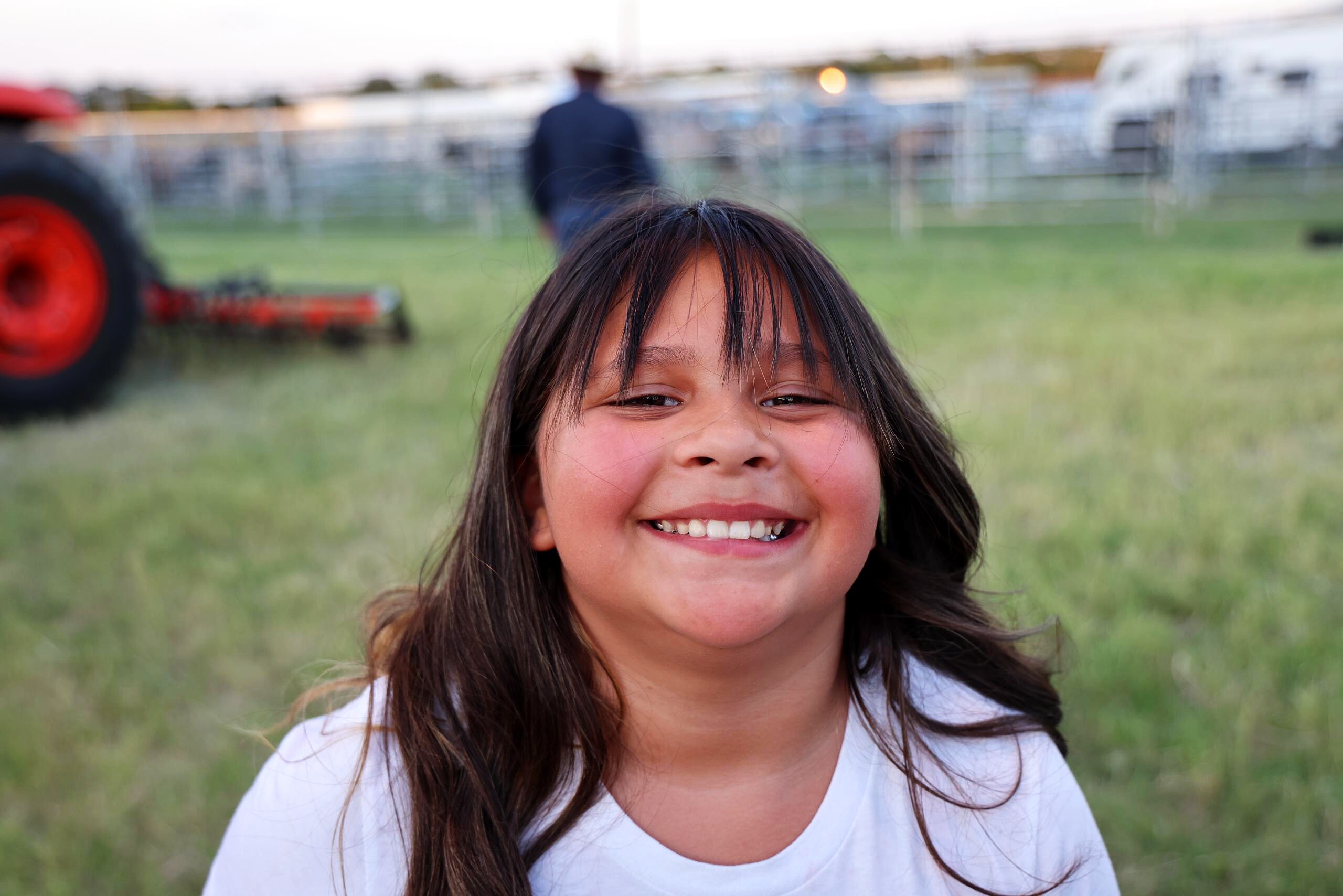 Smiling child portrait at the rodeo grounds