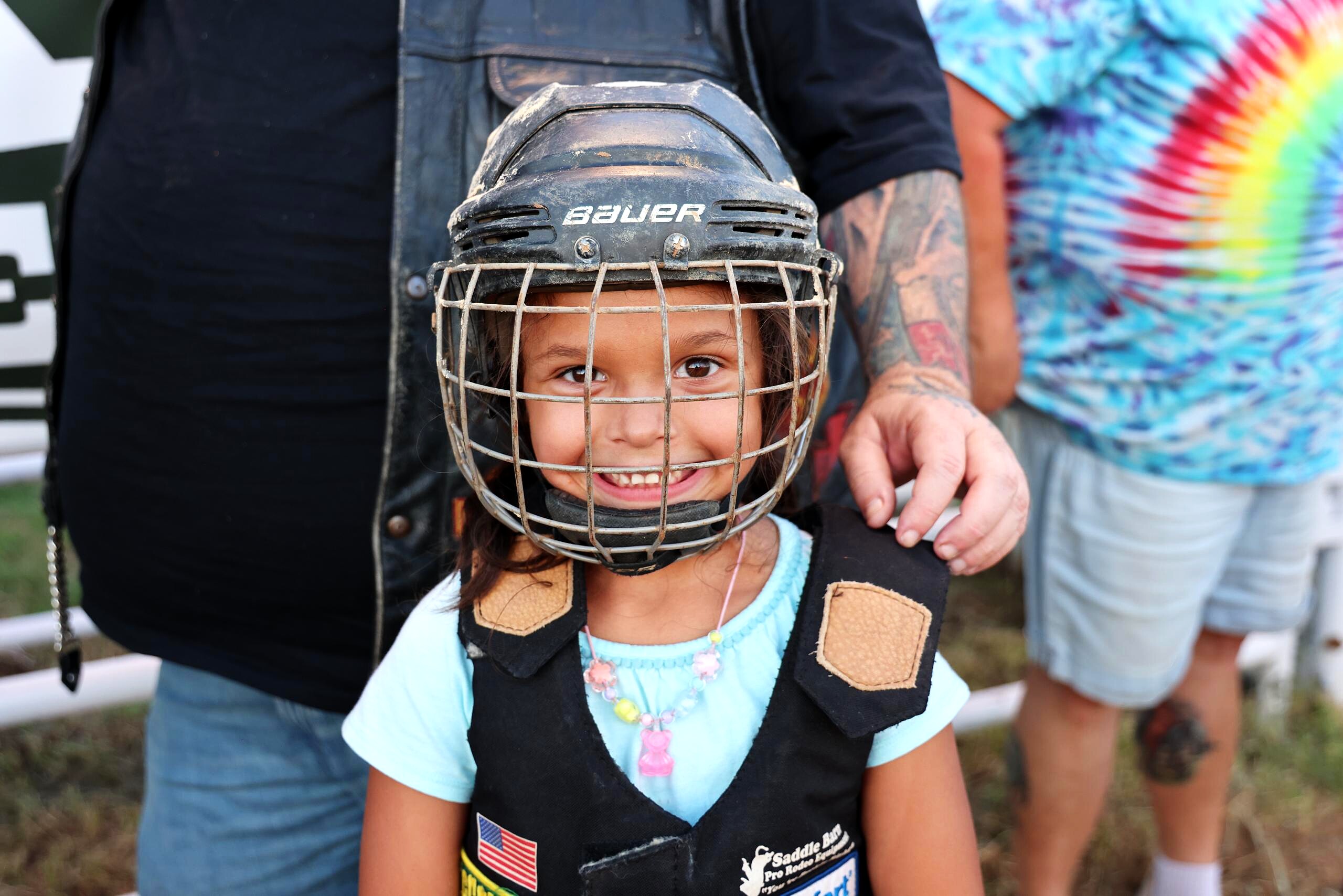 Young mutton busting rider in helmet and vest before the ride